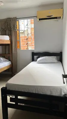 a small bedroom with a bed and a window at GUILLO Comfort Loft 2 in Cartagena de Indias