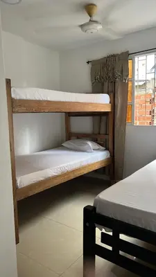 two bunk beds in a room with a window at GUILLO Comfort Loft 2 in Cartagena de Indias