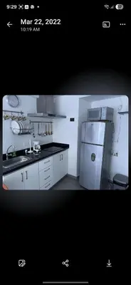 a white kitchen with a refrigerator and a sink at El Laguito Apto Edf Nuevo Conquistador in Cartagena de Indias