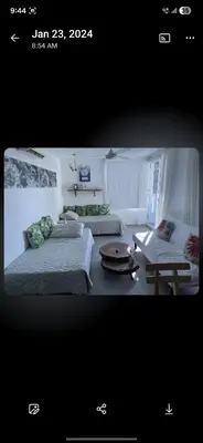 a room with two beds and a table in it at El Laguito Apto Edf Nuevo Conquistador in Cartagena de Indias