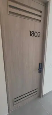 a wooden door with the number on it at Santa marina in Santa Marta