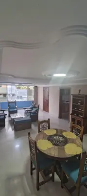 a living room with a table and chairs at Tourist apartment steps from the Historic Center in Cartagena de Indias