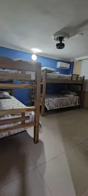 a room with three bunk beds and a ceiling at Tourist apartment steps from the Historic Center in Cartagena de Indias