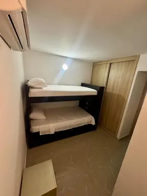 a small room with two bunk beds in it at Apartamento moderno in Cartagena de Indias