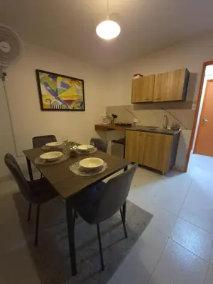 a dining room table and chairs in a kitchen at Hermoso apartamento loft en la ciudad amurallada de cartagena 1 in Cartagena de Indias