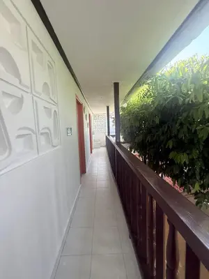 a hallway of a building with plants on it at Hermoso apartamento loft en la ciudad amurallada de cartagena 2 in Cartagena de Indias