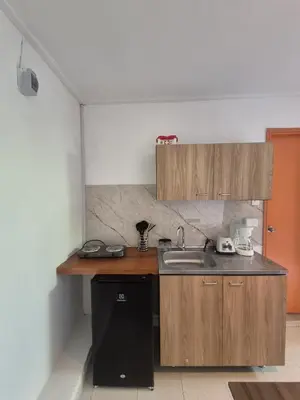 a kitchen with a sink and a counter top at Hermoso apartamento loft en la ciudad amurallada de cartagena 2 in Cartagena de Indias