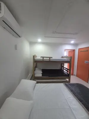 a small room with a bed and a bunk bed at Hermoso apartamento loft en la ciudad amurallada de cartagena 2 in Cartagena de Indias