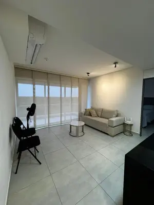 a living room with a couch and a chair at Sensacional Apartamento Serena del Mar in Serena del Mar