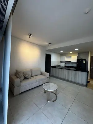 a living room with a couch and a table at Sensacional Apartamento Serena del Mar in Serena del Mar