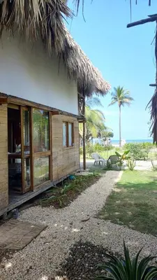 a cabin on the beach with a view of the ocean at CARPE DIEM oceanfront cabin private beach in San Bernardo del Viento