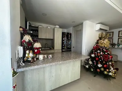 a kitchen with a counter and a christmas tree at Lujoso apartamento frente al Castillo de San Felipe in Cartagena de Indias