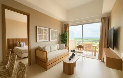 a living room with a couch and a large window at Nuevo Penthouse en Baia Kristal con gran terraza in Cartagena de Indias