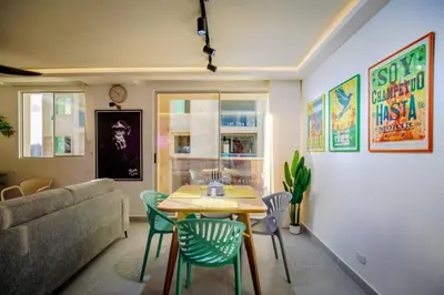 a living room with a table and chairs and a couch at Aguita de coco in Cartagena de Indias