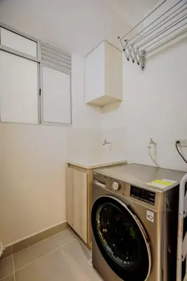 a kitchen with a washing machine in a kitchen at Aguita de coco in Cartagena de Indias