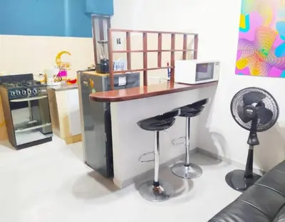 a toy kitchen with a counter and stools at tranquilo alojamiento centro cartagena in Cartagena de Indias