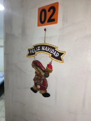 a sticker of a teddy bear hanging on a wall at Hostal Mastcoy in Cartagena de Indias