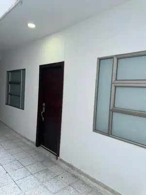 a black door in a white wall with a window at Modern apartment in Boston, Sincelejo in Sincelejo