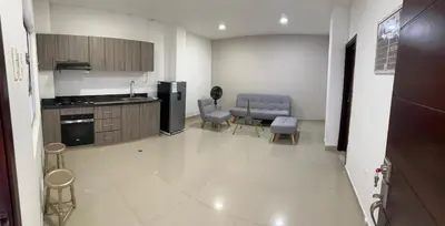 a kitchen with a refrigerator and a table and chairs at Modern apartment in Boston, Sincelejo in Sincelejo