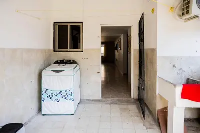 a small refrigerator in a room with a hallway at Charming and relaxing in Manga! Close to Getsemaní in Cartagena de Indias