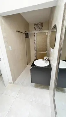 a bathroom with a sink and a mirror at Hotel Zoe in Sampués