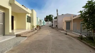 an empty street in a town with buildings at Hotel Zoe in Sampués