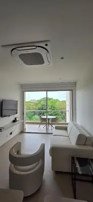 a living room with a couch and a table at Baia Kristal Cartagena Kabo 2-3N in Los Arrayanes
