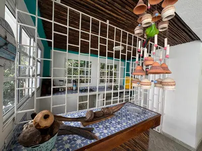 a room with a table with a large turtle on it at Cabaña privada con Jacuzzi a solo un minuto de la playa in Isla de Tierra Bomba