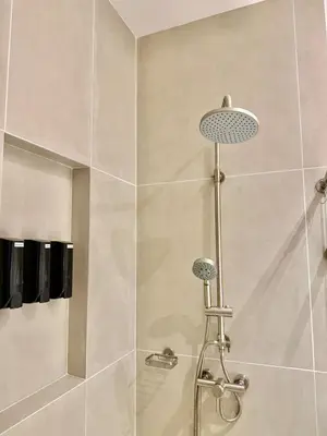 a shower with a shower head in a bathroom at Comfort and Lagoon View at Baia Kristal Cartagena in Los Arrayanes