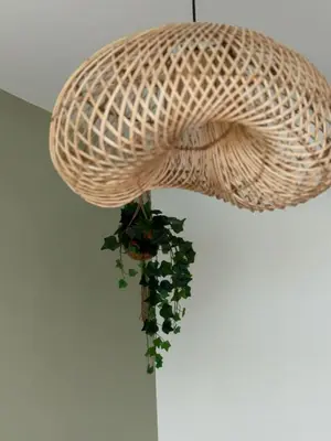 a wicker chandelier with a plant hanging from it at Comfort and Lagoon View at Baia Kristal Cartagena in Los Arrayanes