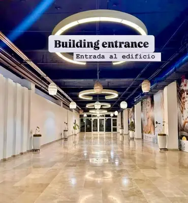 an empty lobby with a building entrance sign on the ceiling at Apartasuit Resort CTG Beach con vista al mar- central 5 min aeropuerto in Cartagena de Indias