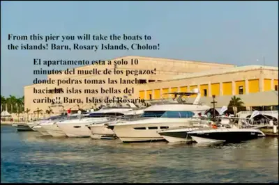 a group of boats parked in a marina at Apartasuit Resort CTG Beach con vista al mar- central 5 min aeropuerto in Cartagena de Indias