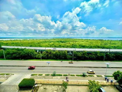 a view of a parking lot with cars on a road at Luxury apartment sea view with pool- central 12 min from the city center in Cartagena de Indias