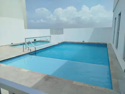 a large swimming pool with blue water at Ciudad Amurallada in Cartagena de Indias