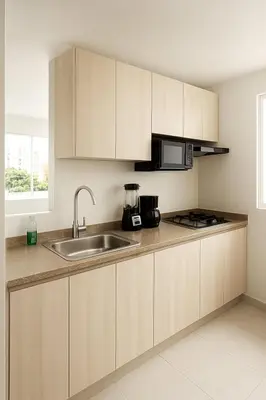 a kitchen with wooden cabinets and a sink at VIP Cartagena Close to the 415 Wall in Cartagena de Indias