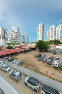 a parking lot with parked cars in a city at VIP Cartagena Close to the 415 Wall in Cartagena de Indias