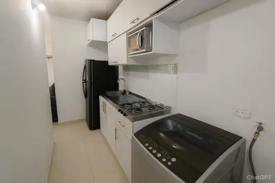 a small kitchen with a stove and a microwave at Cartagena near the historic center and beaches in Cartagena de Indias
