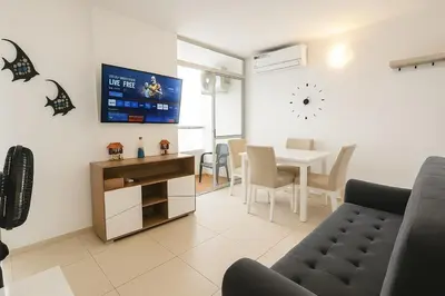 a living room with a table and a dining room at Cartagena near the historic center and beaches in Cartagena de Indias