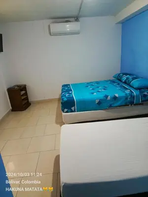a bedroom with two beds and a white mattress at Hospedaje Bosque Mar in Cartagena de Indias