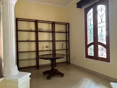 a room with a table and stained glass windows at Mansión Lujosa con Piscina en manga in Cartagena de Indias