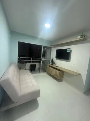 a living room with a couch and a flat screen tv at Piso Don Omar in Cartagena de Indias