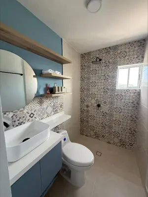 a bathroom with a white toilet and a sink at Piso Don Omar in Cartagena de Indias