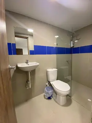 a bathroom with a toilet and a sink at HOTEL DIMAR i in Cartagena de Indias