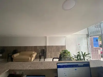 a laptop computer sitting on a counter in a living room at HOTEL DIMAR i in Cartagena de Indias