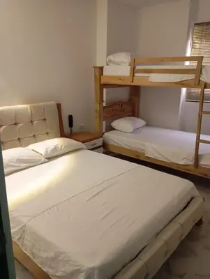 a room with two bunk beds in it at Hotel Santa Ana in Baranoa