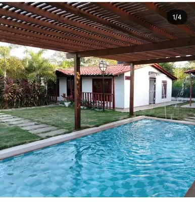 a swimming pool in front of a house at Casa 550 in Turbaco