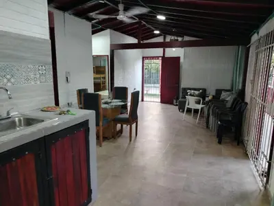 a kitchen and living room with a table and chairs at Casa 550 in Turbaco