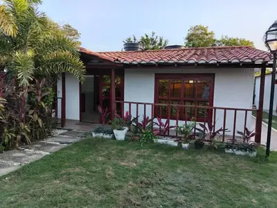 a small white house with a red roof at Casa 550 in Turbaco