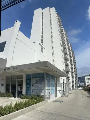 a large white building with a building at Modern Apartment Near the Sea in Cartagena de Indias