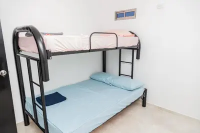 a bunk bed in a room with a bunk bed in a room at Apartamentos King Arthur in Punta Seca
